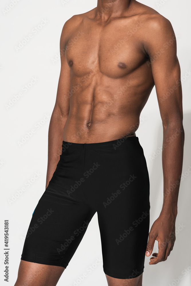 Man in black compression shorts for swimwear fashion shoot Man in black compression shorts for swimwear fashion shoot