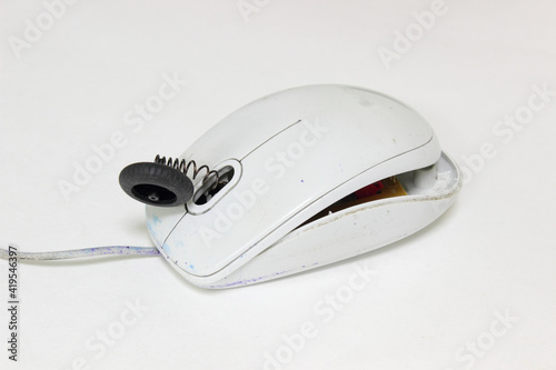 Old broken computer mouse. Conceptual photo of one of the possible causes of carpal tunnel syndrome. 