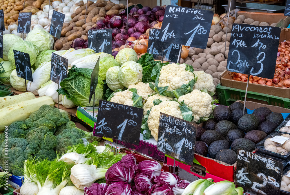 Big choice of fresh vegetables and salad for sale at a market
