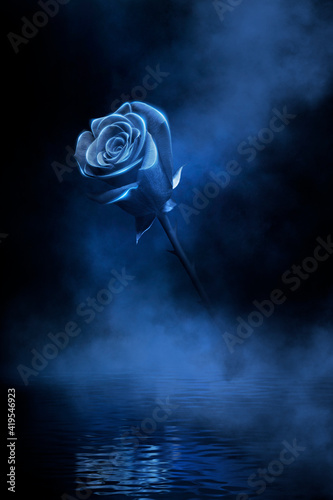 Neon rose in a flask. Dark ...