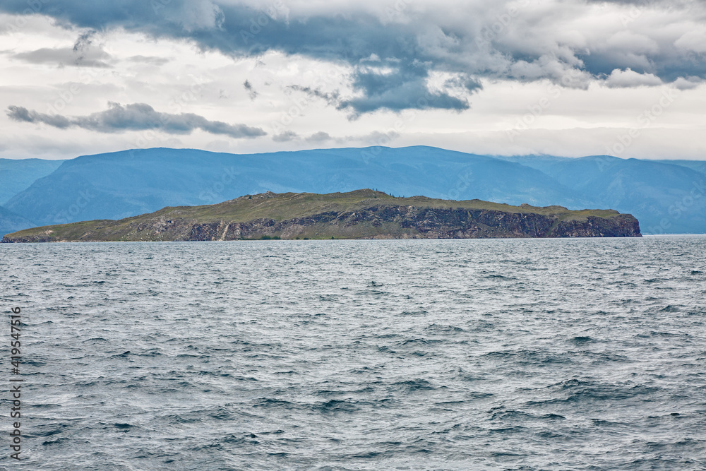 Lake Baikal in cloudy weather. Cold summer