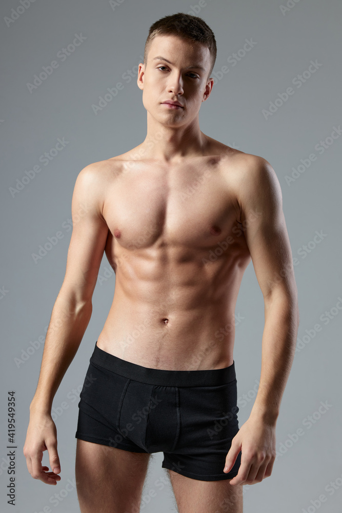 athletic male bodybuilder with pumped up abs black panties cropped view studio athletic male bodybuilder with pumped up abs black panties cropped view studio