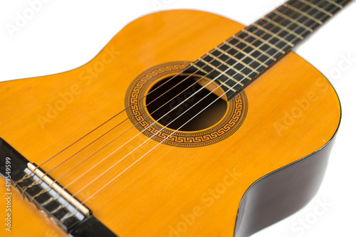 Acoustic guitar isolated on white, close