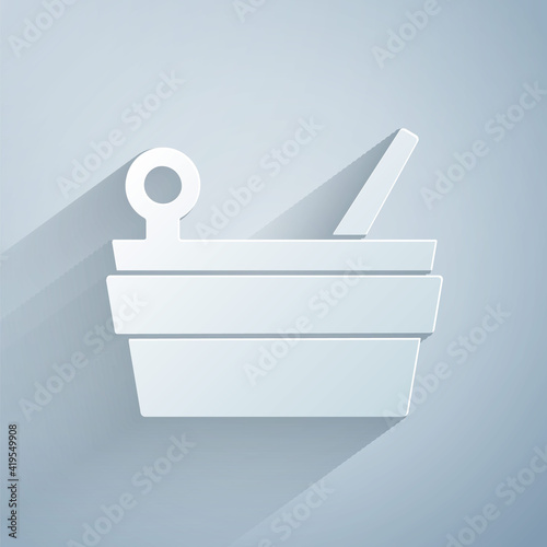 Paper cut Sauna bucket and ladle icon isolated on grey background. Paper art style. Vector.