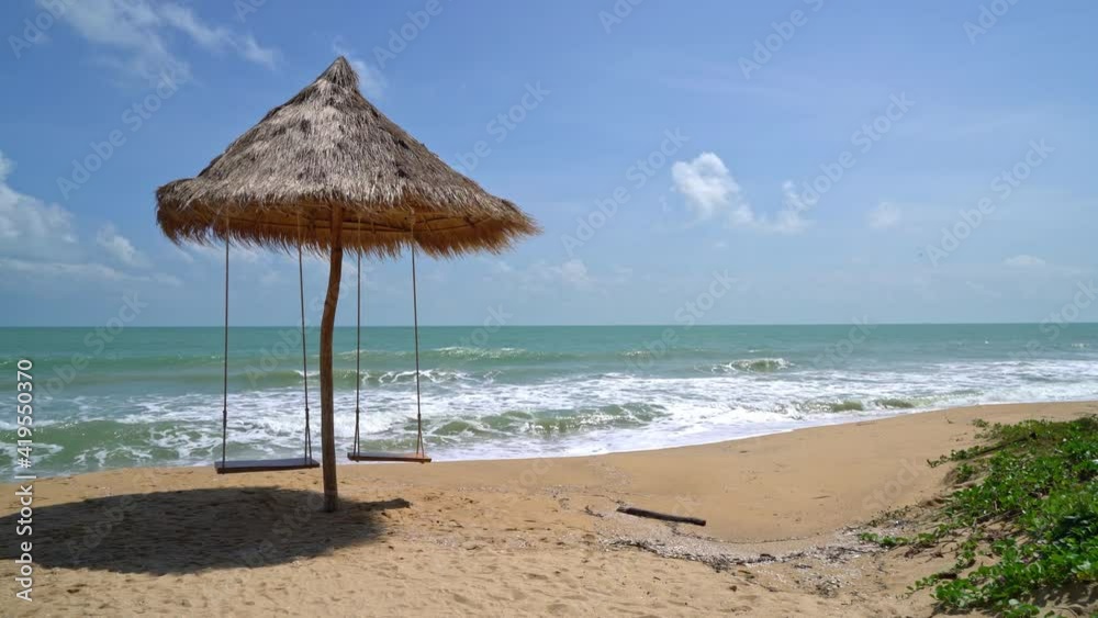 swing on beach with ocean sea and blue sky background swing on beach with ocean sea and blue sky background