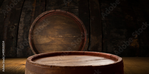 A wine cellar full of barrels of wine