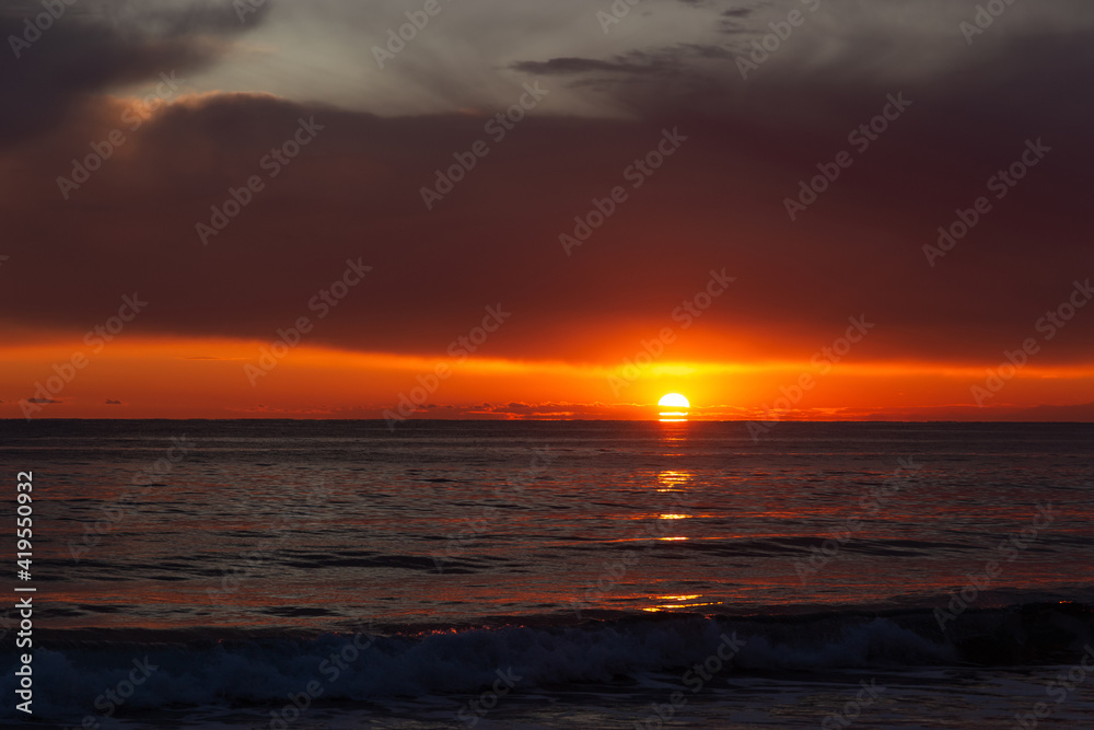 View of a sunset over a sea.