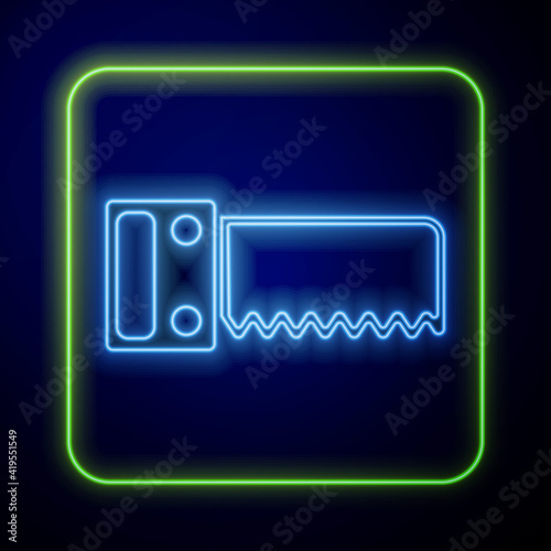Glowing neon Hand saw icon isolated on blue background. Vector.