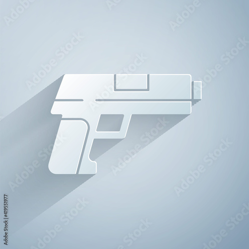 Paper cut Pistol or gun icon isolated on grey background. Police or military handgun. Small firearm. Paper art style. Vector.