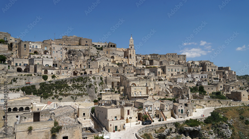 Sassi di Matera historic site aerial cityscape with cathedral or church on the hill, popular tourist travel place, guided tour concept, Basilicata, Italy