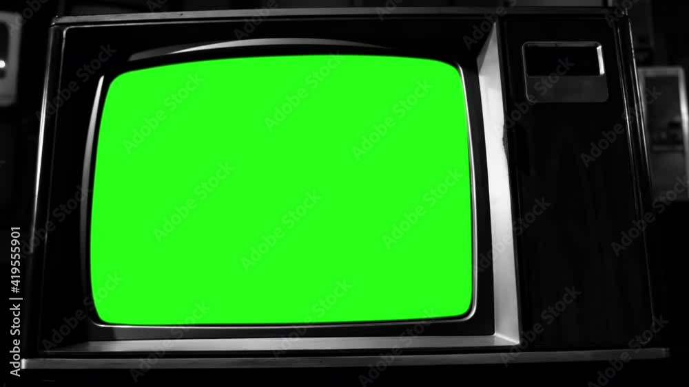 Old TV Set Turning On Green Screen Zoom Into The Green Screen Black old-tv-set-turning-on-green-screen-zoom-into-the-green-screen-black