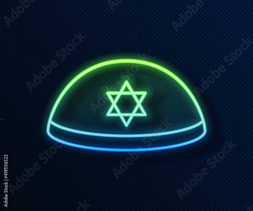 Glowing neon line Jewish kippah with star of david icon isolated on blue background. Jewish yarmulke hat. Vector. photo