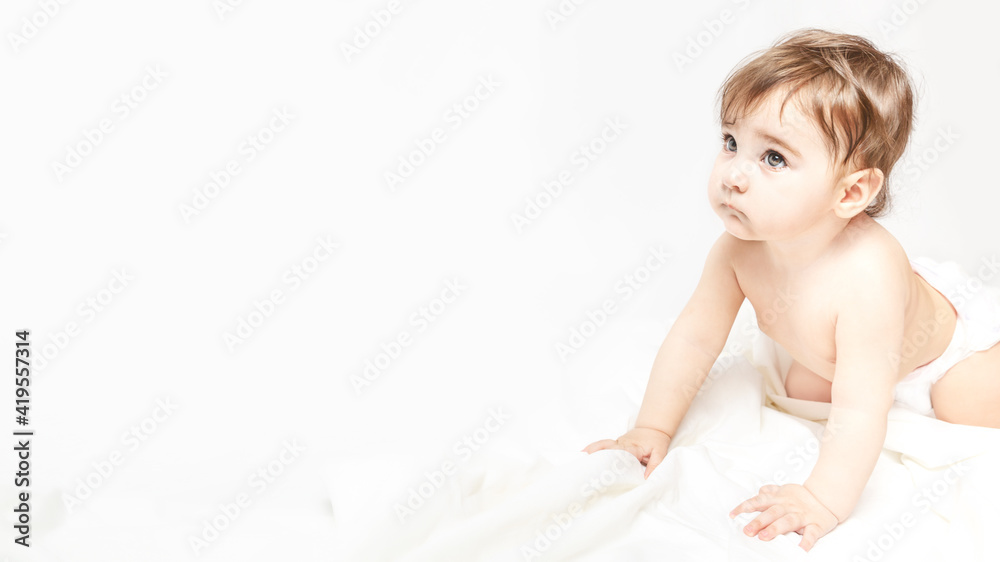 childhood, babyhood and people concept - little baby boy or girl crawling on floor at home childhood, babyhood and people concept - little baby boy or girl crawling on floor at home