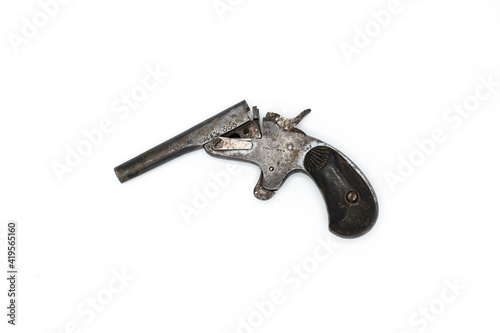 Barcelona, Spain; February 5, 2021: Small mini collector's pistol, on white background. 1924 cal 6mm number 335