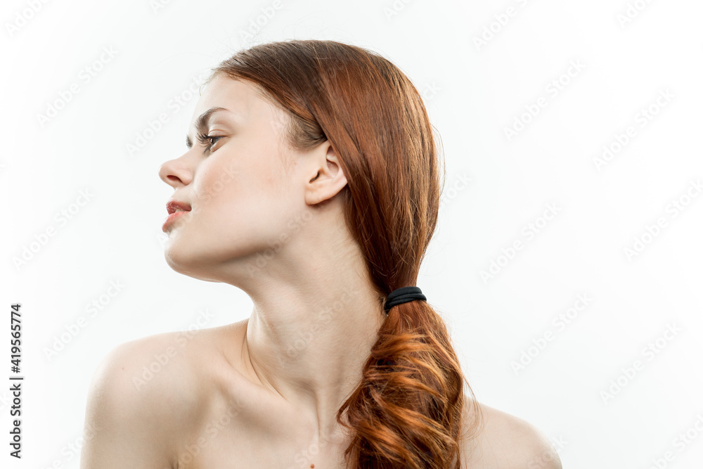 Naklejka premium woman holding hands near face posing model light background