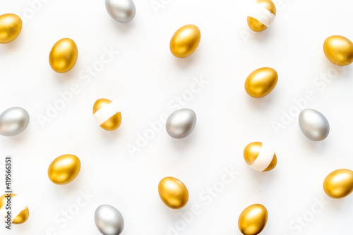 Silver and golden Easter eggs. Easter decoration, top view