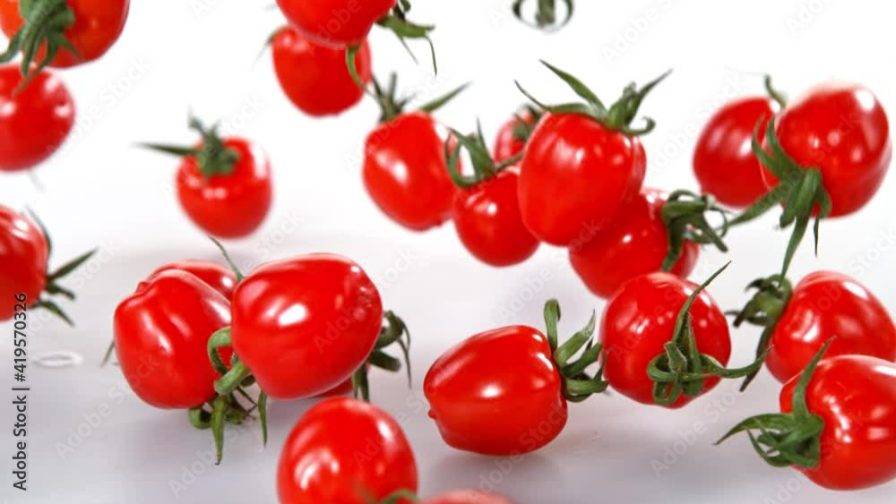 Super Slow Motion Shot of Cherry Tomatoes Falling on White Background at 1000fps. Super Slow Motion Shot of Cherry Tomatoes Falling on White Background at 1000fps.