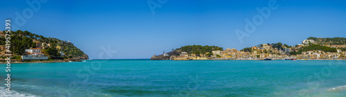 beach with trees and buildings in the village of Port de Soller on the balearic island of Mallorca, spain