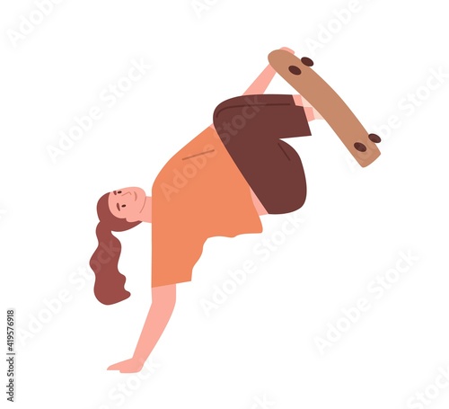 Female skateboarder pushing off with hand and performing diffficult trick on ...