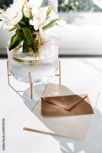 Flat lay envelops for a mockup for wedding invitation, birthday. Composition mockup stationery concept with a bouquet of flowers.