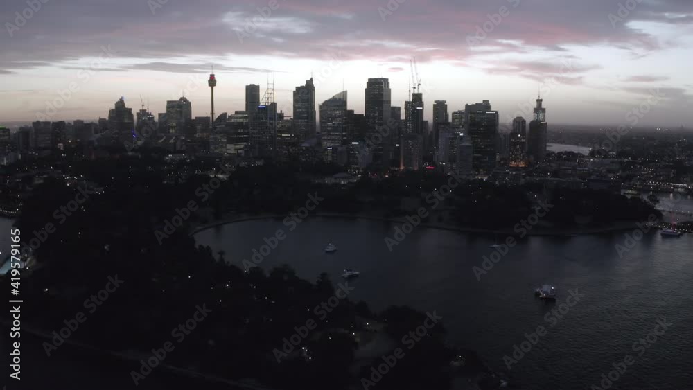 Aerial Forward: City During The Nigh Near The Harbor