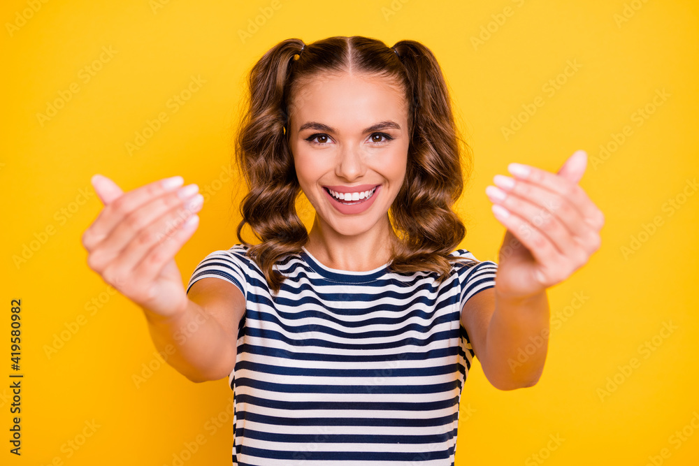 Photo of adorable sweet young woman wear striped clothes open arms invite you hugging isolated yellow color background Photo of adorable sweet young woman wear striped clothes open arms invite you hugging isolated yellow color background