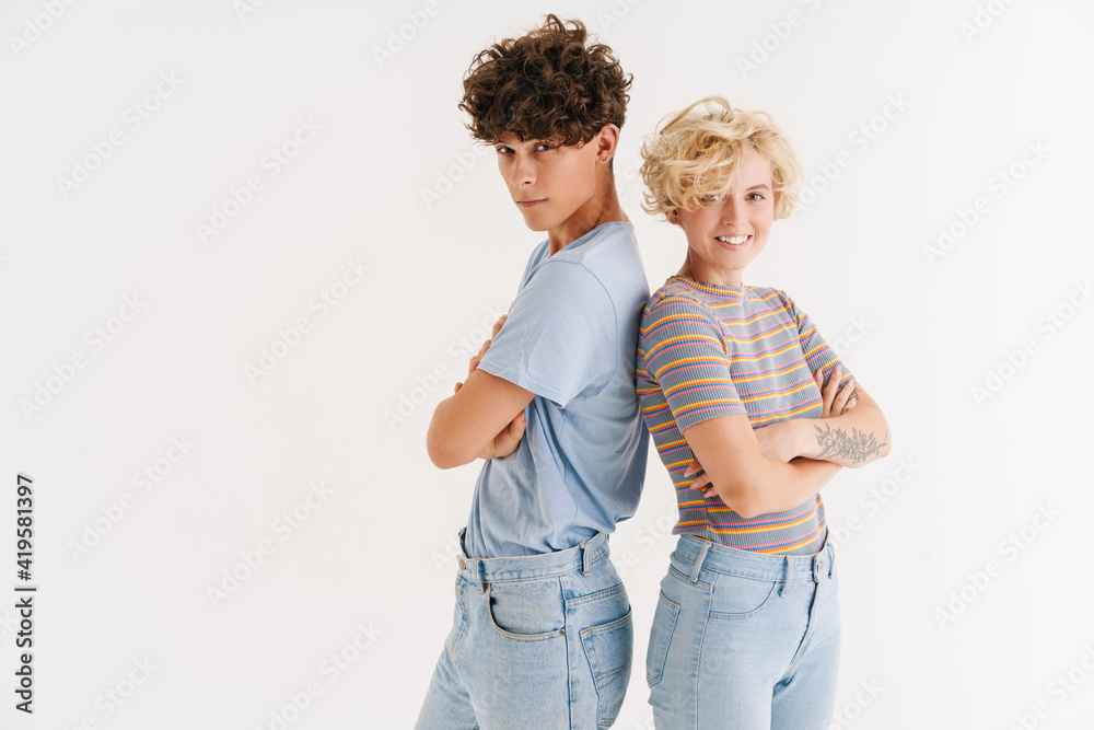 Young loving couple posing isolated over white background Young loving couple posing isolated over white background