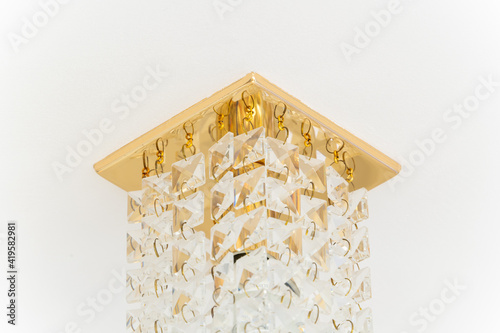 Ceiling lamp with gold base and hanging crystal cubes photo