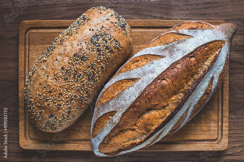 Whole grain bread on a wooden background. Healthy food concept. Of natural starter culture