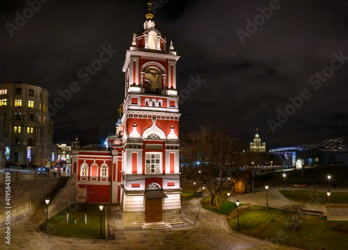 night view of city church with red walls and white backlight