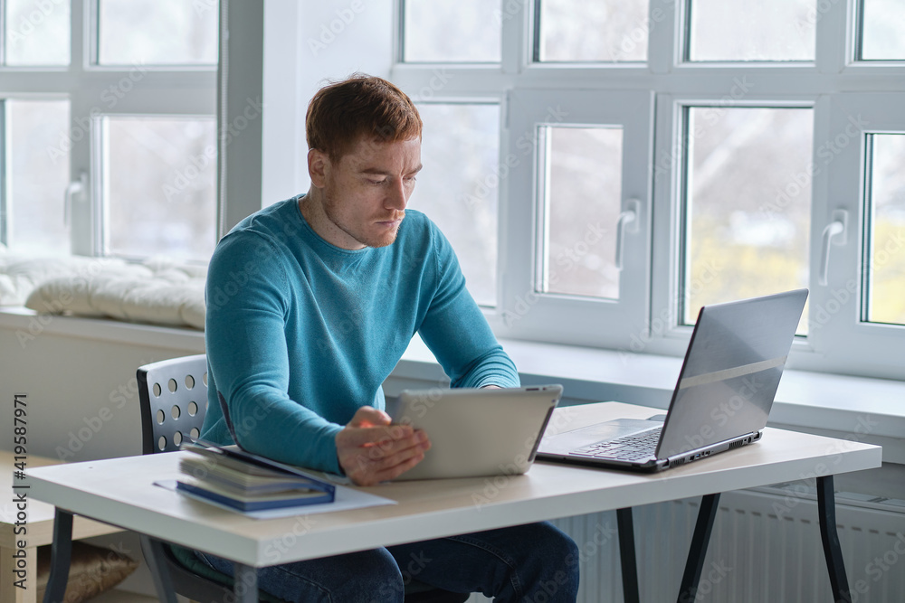 guy works from home. man using laptop, typing on keyboard, writing email or message, chatting, shopping, successful freelancer working online on computer. guy works from home. man using laptop, typing on keyboard, writing email or message, chatting, shopping, successful freelancer working online on computer.