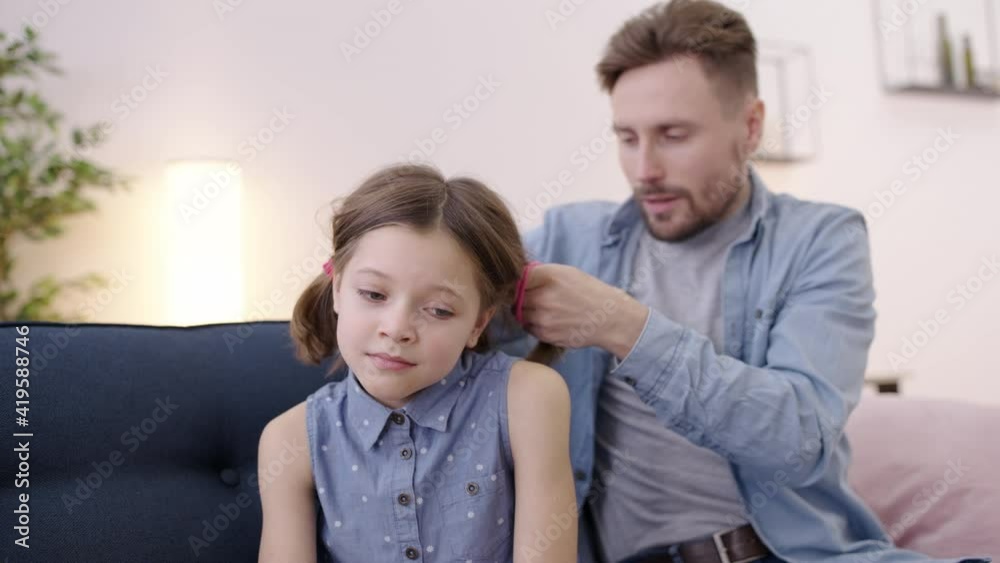 Single dad trying to do daughter's hair, difficulties of parenthood, upbringing Single dad trying to do daughter's hair, difficulties of parenthood, upbringing