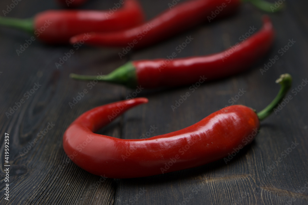 Hot peppers on a wooden background ingredient spicy