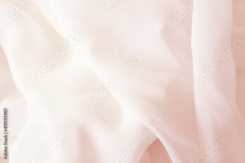 light silky smooth pastel pink cloth background © Iveta