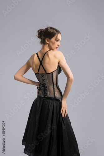 Elegant slim woman in skirt and corset