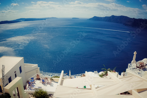 view of white buildings on Greek island with blue sea and sky