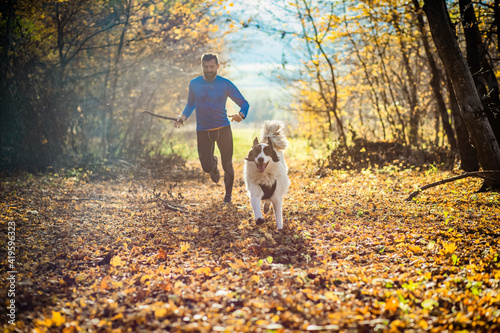 Obraz na plátně trail runner and his dog running