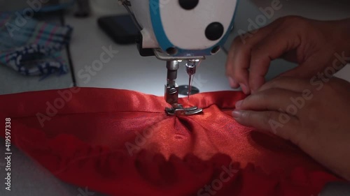 Closeup Hand sewing with in factory production	