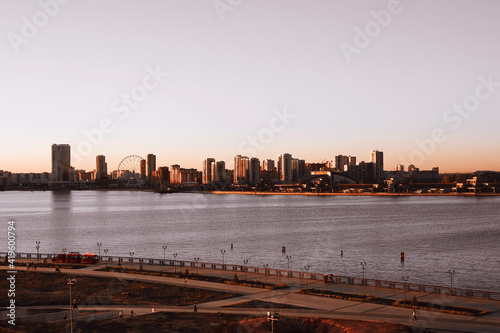 Sunset in the city embankment