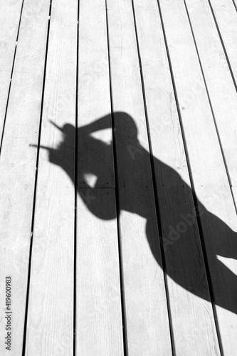 Girl playing with her shadow