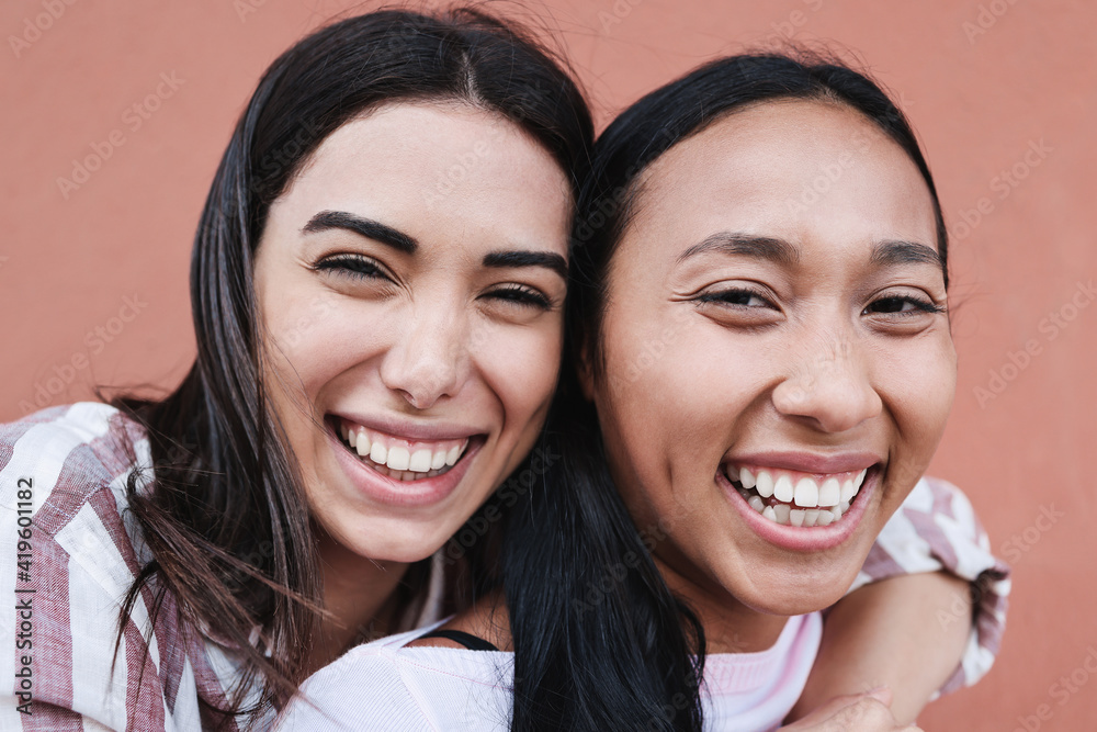Hispanic friends having fun together - Young latin people lifestyle concept - Main focus on right girl face Hispanic friends having fun together - Young latin people lifestyle concept - Main focus on right girl face