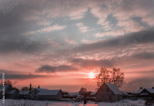 Evening winter sunset in the village