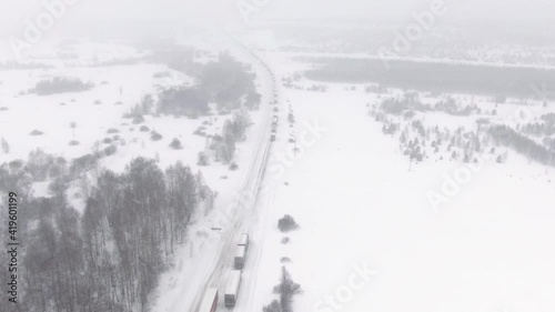 Wallpaper Mural Trucks are stuck in traffic on a snow-covered highway. Thousands stranded on highway as major snowstorm and blizzard hits hard causing Torontodigital.ca