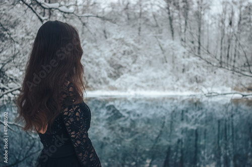 Country photo session of a girl on a blue lake