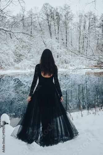 Country photo session of a girl on a blue lake