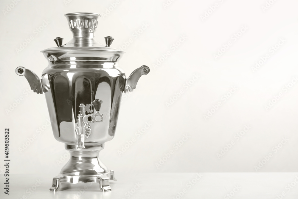 Traditional Russian samovar on white background. Space for text Traditional Russian samovar on white background. Space for text