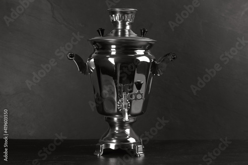 Traditional Russian samovar on dark background. Kitchenware