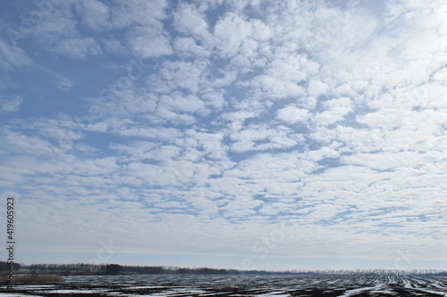 White clouds in the blue sky.