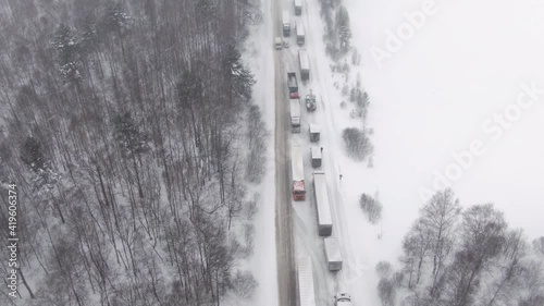 Wallpaper Mural Trucks are stuck in traffic on a snow-covered highway. Thousands stranded on highway as major snowstorm and blizzard hits hard causing Torontodigital.ca