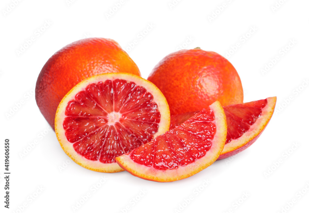 Whole and cut red oranges on white background Whole and cut red oranges on white background